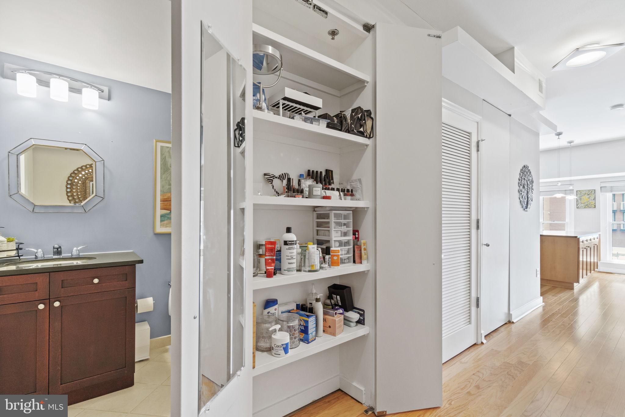 675 E Street Northwest, Unit 500 Washington, DC 20004 - Photo 7 of 52 a kitchen with a refrigerator and cabinets