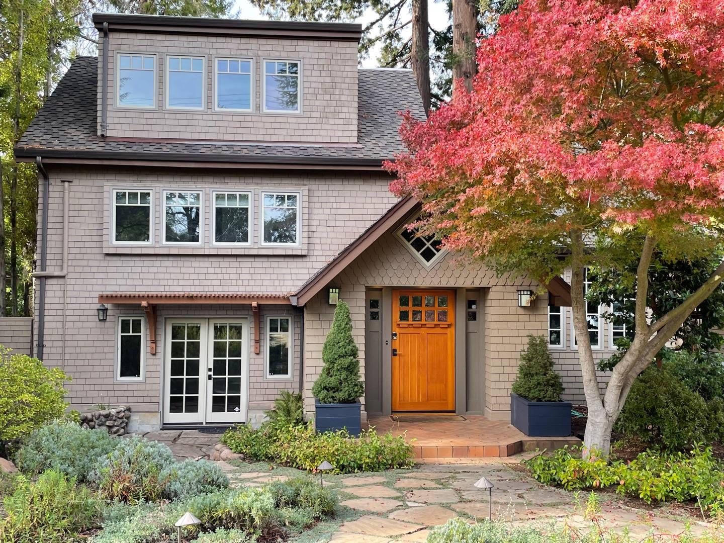 a front view of a house with garden