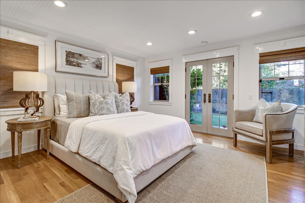 836 Creek Drive Menlo Park, CA 94025 - Photo 15 of 39 a spacious bedroom with a bed and glass walk in closet