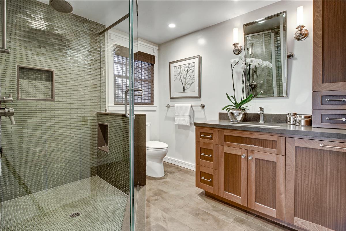 836 Creek Drive Menlo Park, CA 94025 - Photo 24 of 39 a spacious bathroom with a granite countertop sink a toilet a mirror and shower