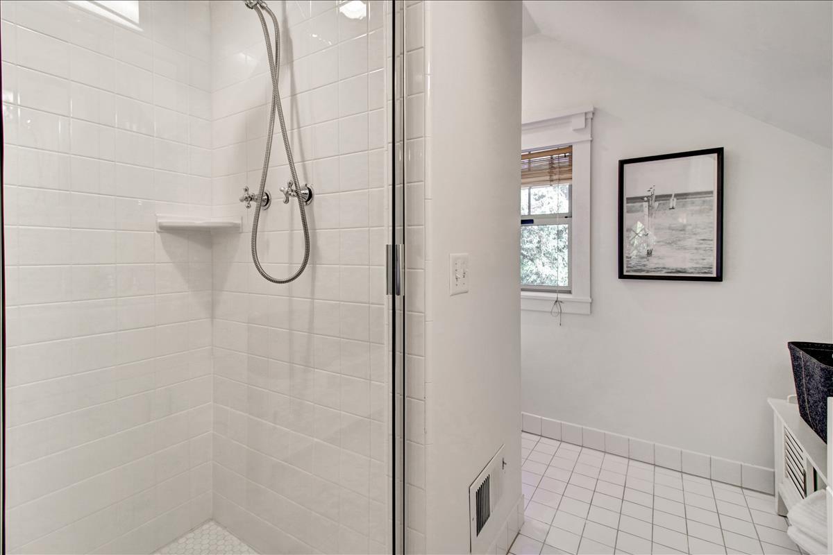 836 Creek Drive Menlo Park, CA 94025 - Photo 28 of 39 a bathroom with a glass shower door