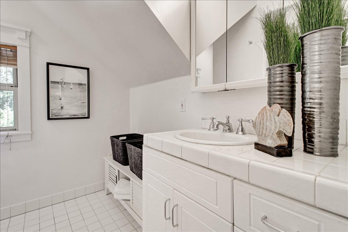 836 Creek Drive Menlo Park, CA 94025 - Photo 29 of 39 a bathroom with a sink and a mirror