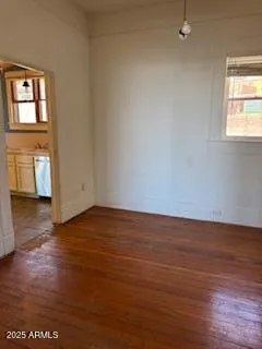 a kitchen with a checkered floor and white cabinets