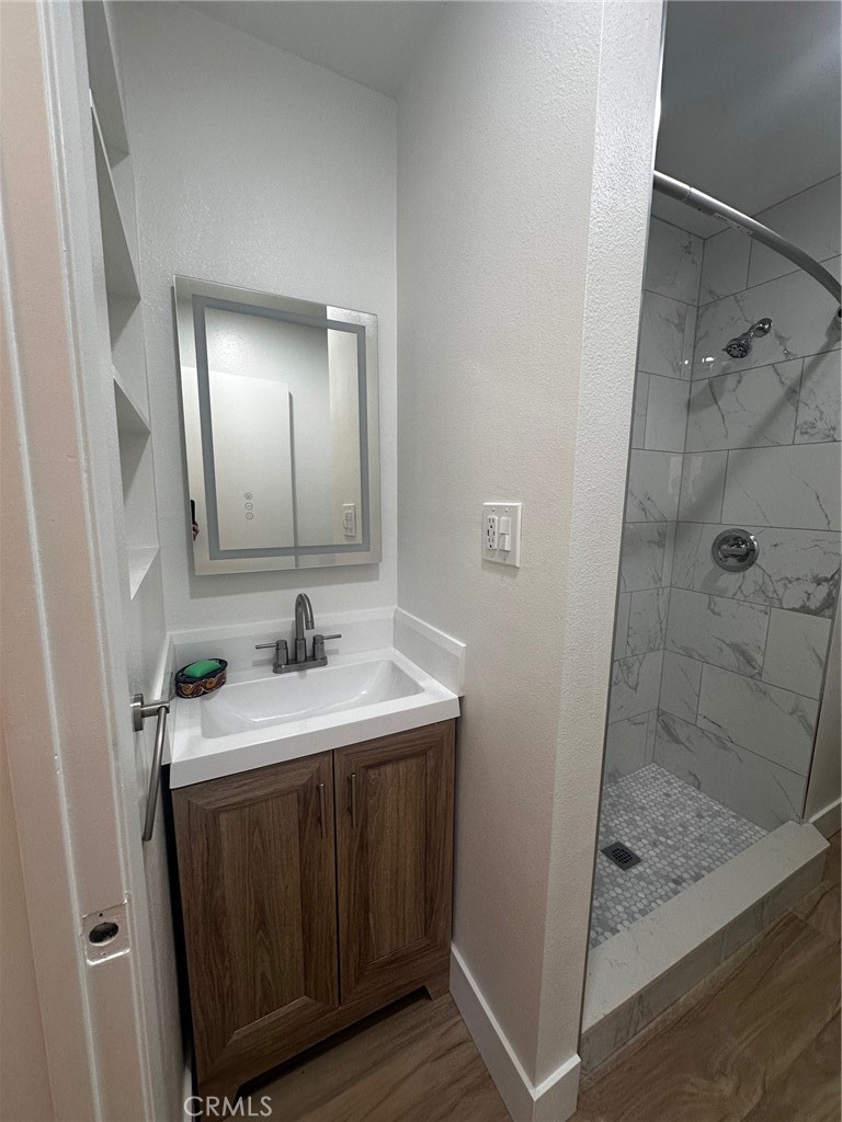25626 1/2 Oak Street Lomita, CA 90717 - Photo 27 of 39 a bathroom with a sink a toilet and shower