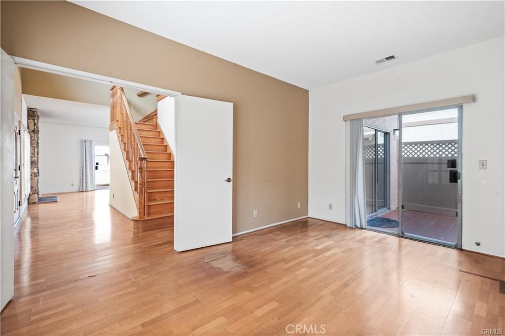25626 1/2 Oak Street Lomita, CA 90717 - Photo 28 of 39 a view of an empty room with wooden floor and a bathroom