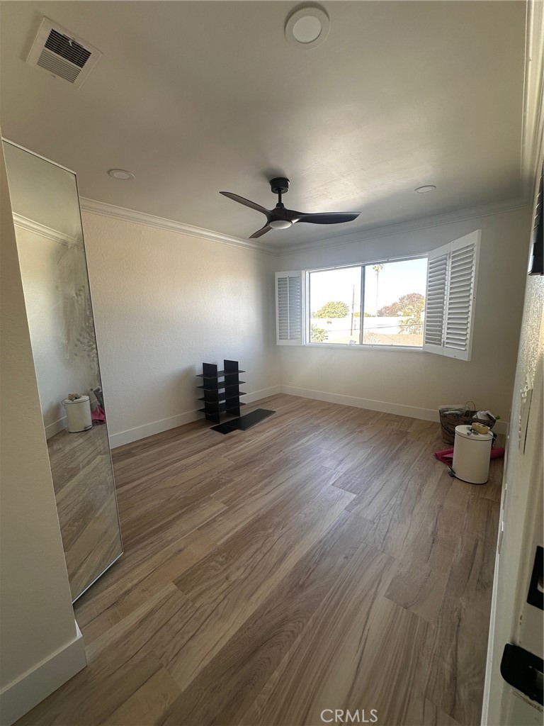 25626 1/2 Oak Street Lomita, CA 90717 - Photo 32 of 39 wooden floor in an empty room with a window