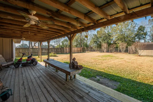a view of a room with gym equipment and windows