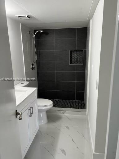 18344 Northwest 68th Avenue, Unit F Hialeah, FL 33015 - Photo 11 of 14 a bathroom with a shower toilet and sink