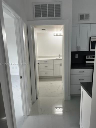 18344 Northwest 68th Avenue, Unit F Hialeah, FL 33015 - Photo 12 of 14 a bathroom with a shower