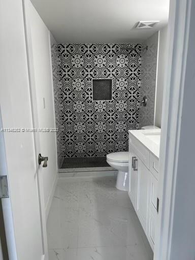 18344 Northwest 68th Avenue, Unit F Hialeah, FL 33015 - Photo 13 of 14 a bathroom with a toilet and a shower