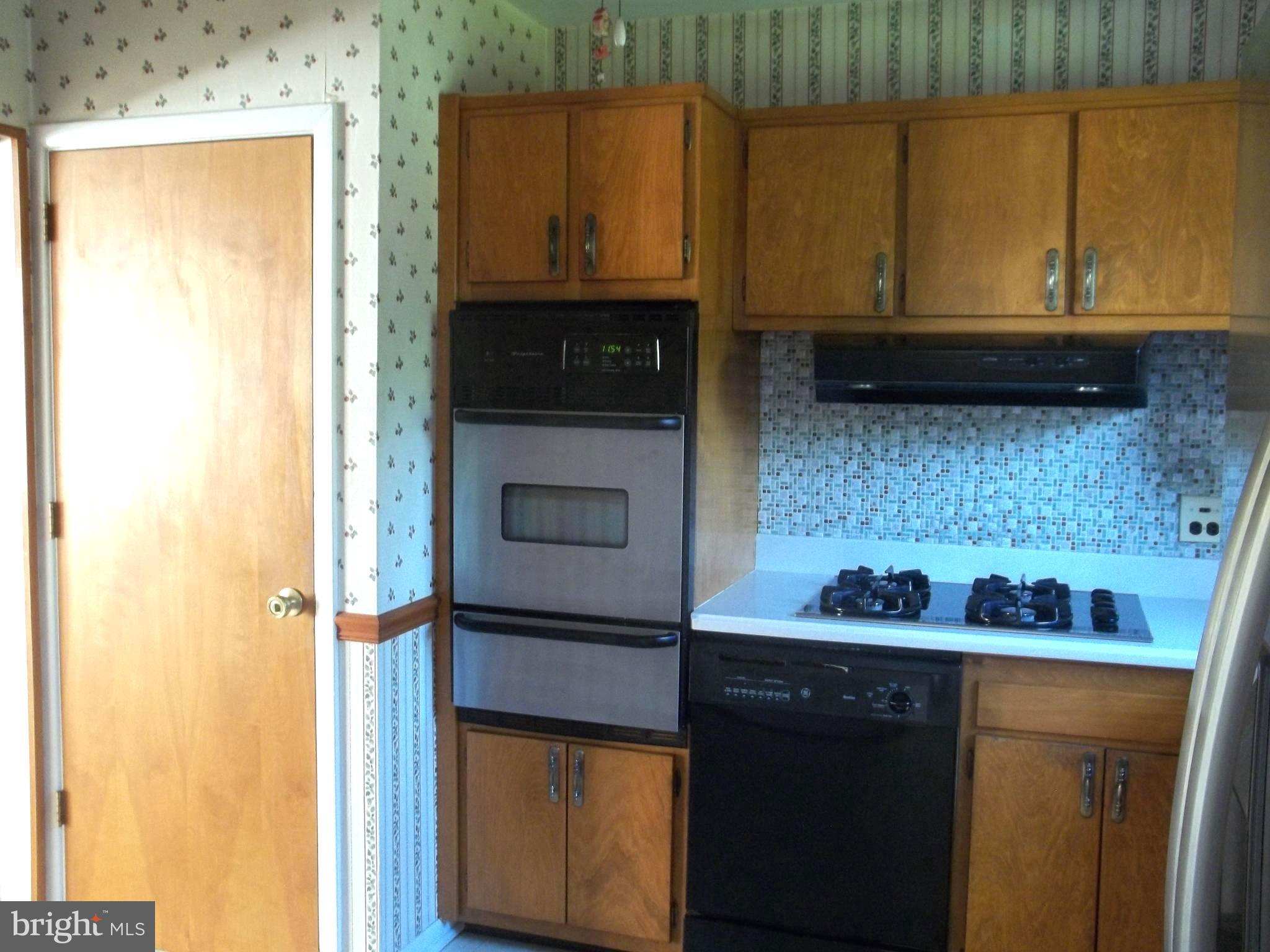 5 Broadale Road Doylestown, PA 18901 - Photo 16 of 27 a kitchen with a sink a microwave cabinets and utility