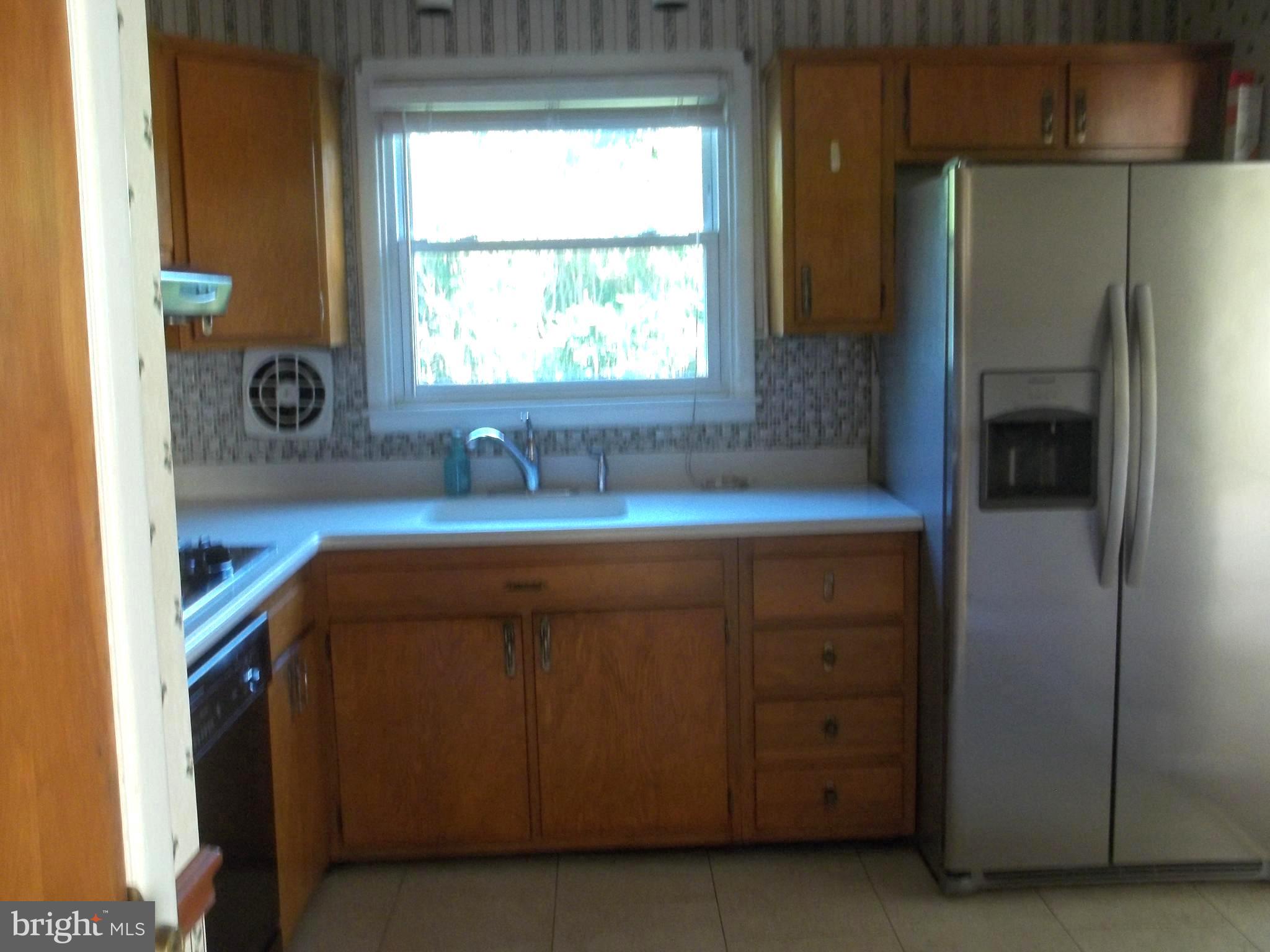 5 Broadale Road Doylestown, PA 18901 - Photo 17 of 27 a kitchen with a sink and a refrigerator