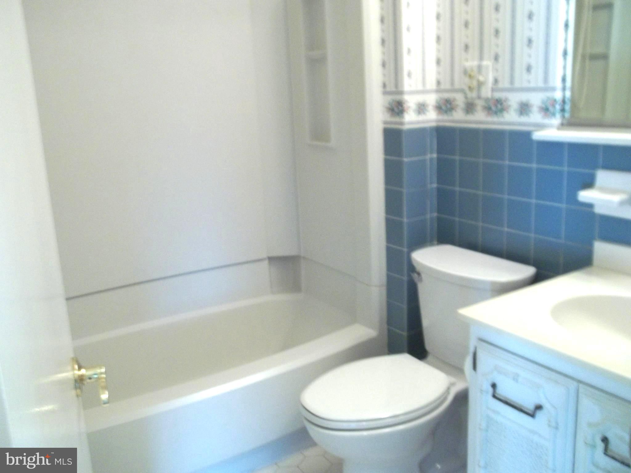 5 Broadale Road Doylestown, PA 18901 - Photo 20 of 27 a white toilet sitting next to a bath tub