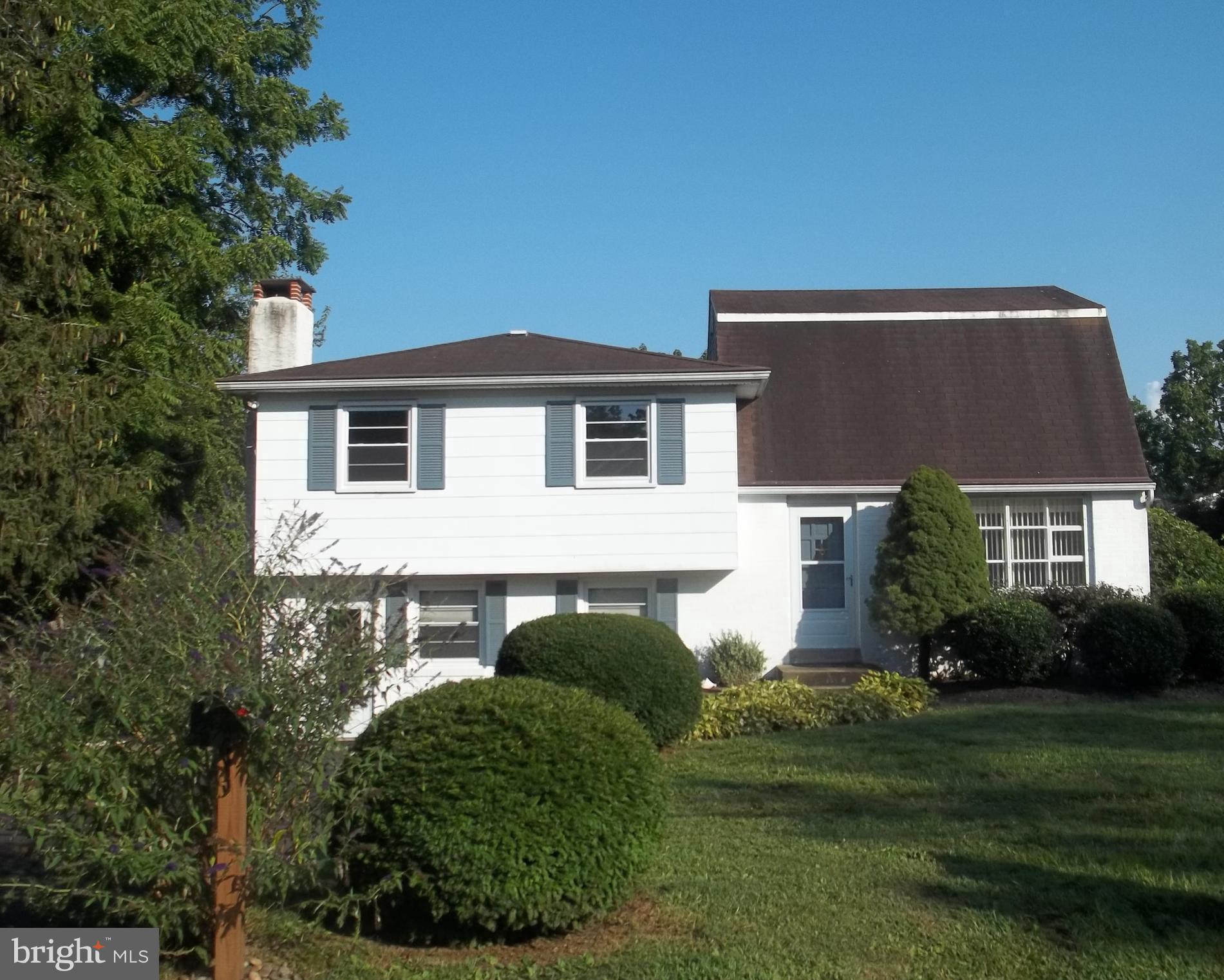 5 Broadale Road Doylestown, PA 18901 - Photo 2 of 27 a front view of a house with a yard and garage