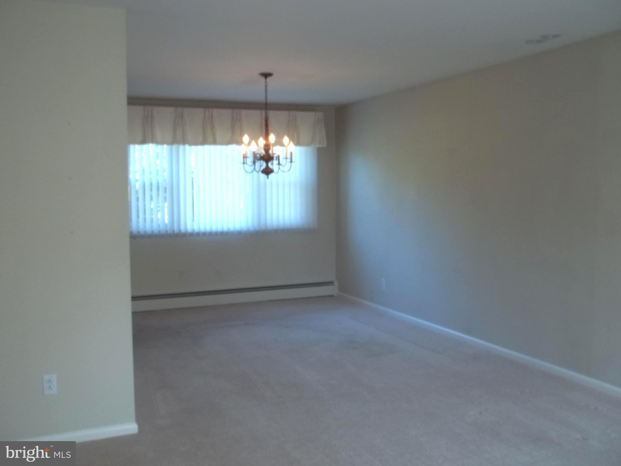 5 Broadale Road Doylestown, PA 18901 - Photo 27 of 27 an empty room with chandelier fan and windows