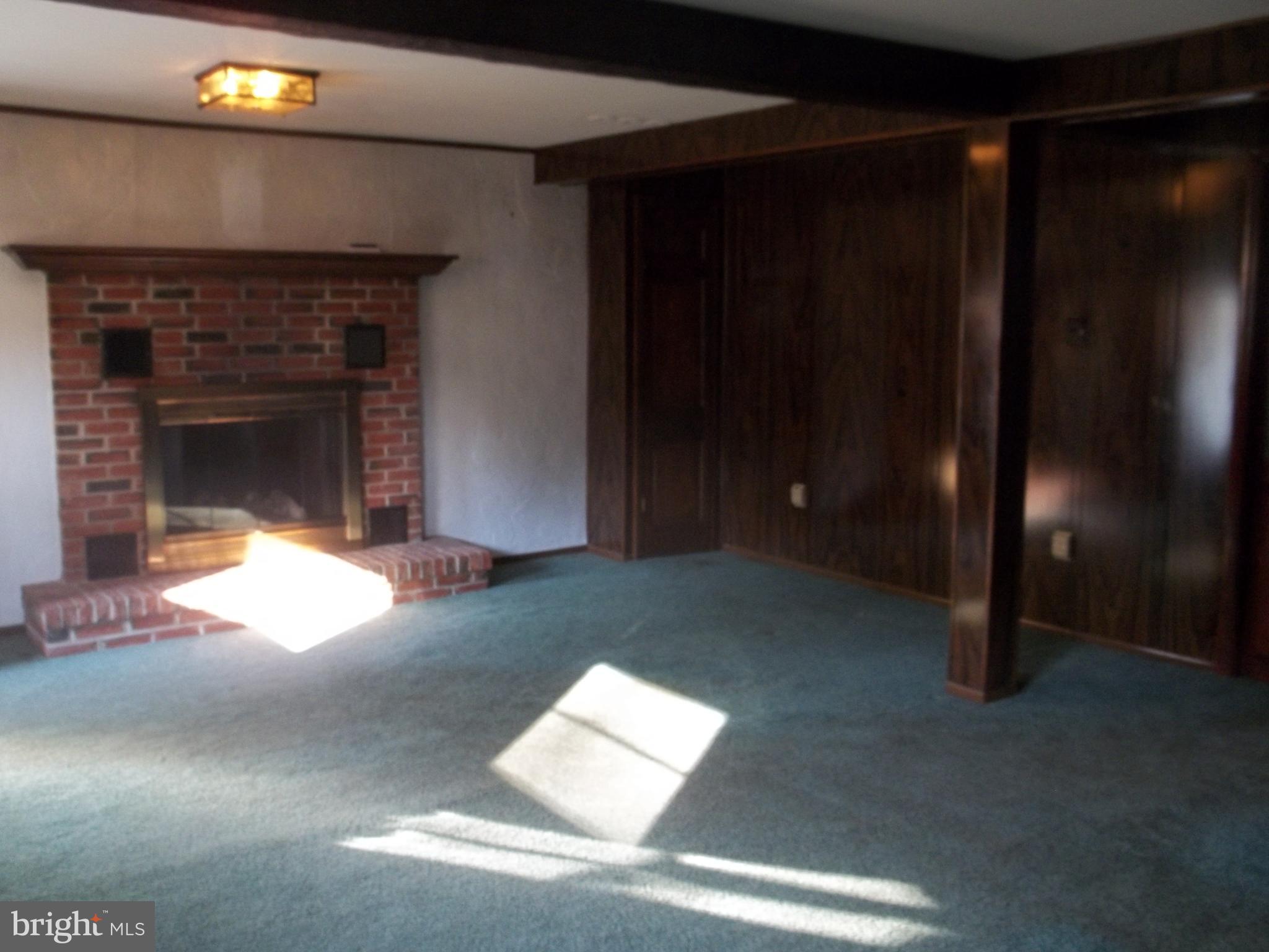 5 Broadale Road Doylestown, PA 18901 - Photo 10 of 27 a living room with furniture and a fireplace