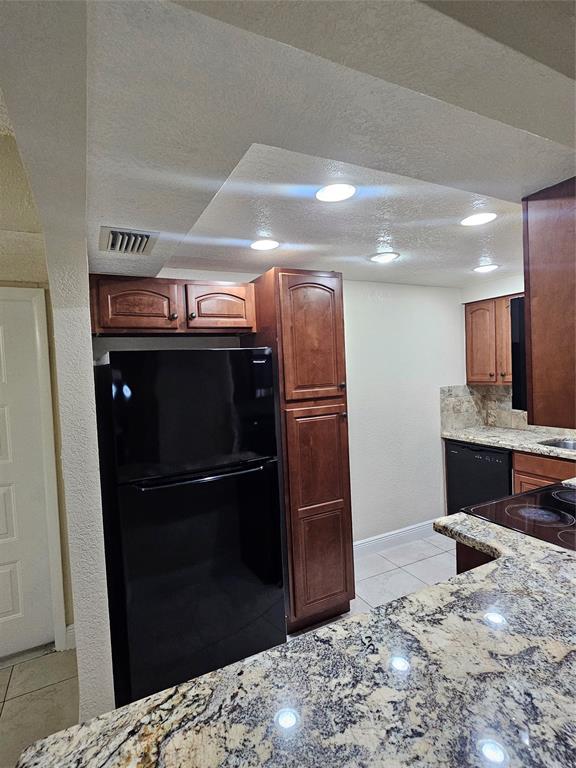 3720 North Pine Island Road, Unit 428 Sunrise, FL 33351 - Photo 17 of 22 a kitchen with a refrigerator and a sink