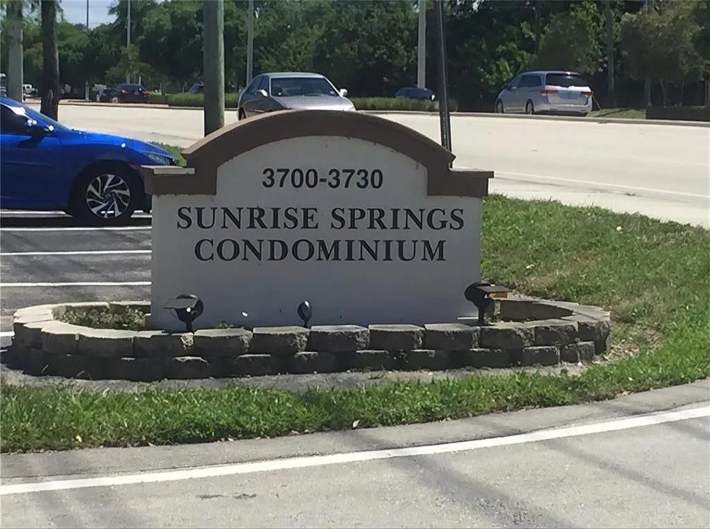 3720 North Pine Island Road, Unit 428 Sunrise, FL 33351 - Photo 22 of 22 a front view of a house with garden