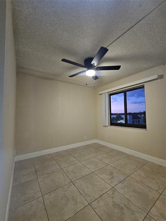 3720 North Pine Island Road, Unit 428 Sunrise, FL 33351 - Photo 9 of 22 a view of an empty room with a window
