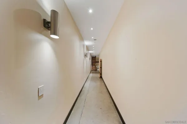 a view of a hallway with bathroom