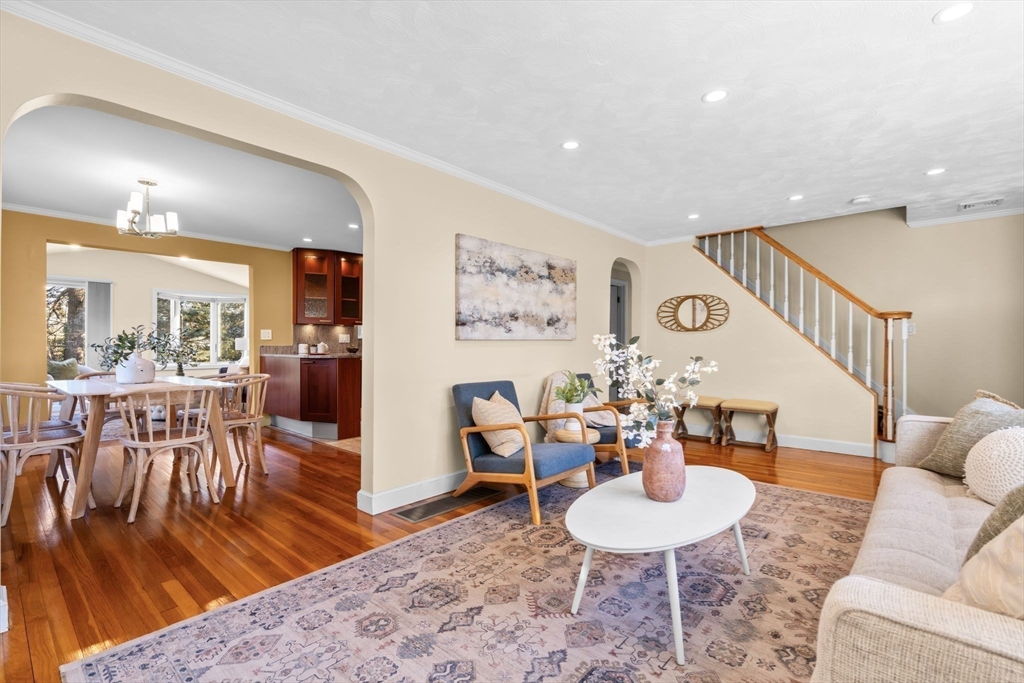 512 Appleton Street Arlington, MA 02476 - Photo 20 of 42 a living room with furniture and a dining table with wooden floor