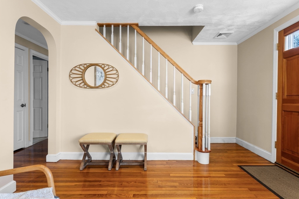 512 Appleton Street Arlington, MA 02476 - Photo 25 of 42 a view of a hallway with wooden floor and staircase