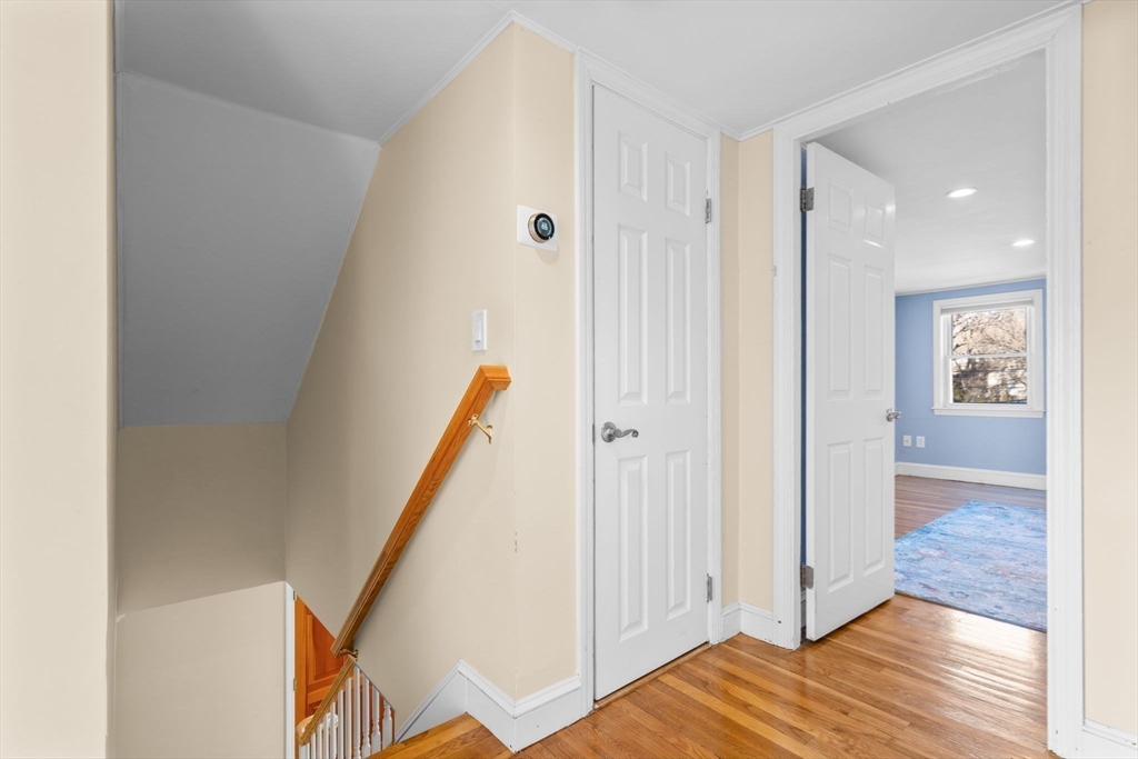 512 Appleton Street Arlington, MA 02476 - Photo 26 of 42 a view of a hallway with wooden floor and entryway