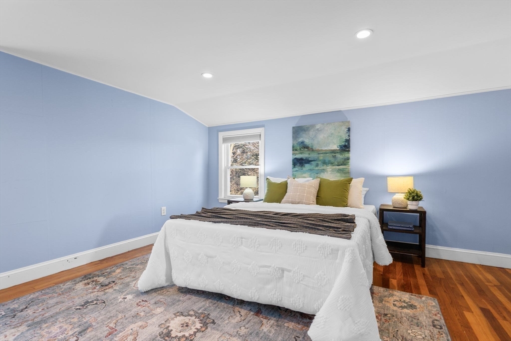 512 Appleton Street Arlington, MA 02476 - Photo 29 of 42 a bedroom with a bed and a lamp on dresser