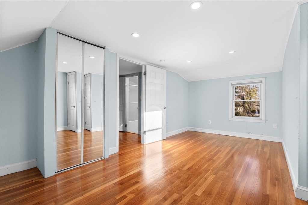 512 Appleton Street Arlington, MA 02476 - Photo 30 of 42 a view of an empty room with wooden floor