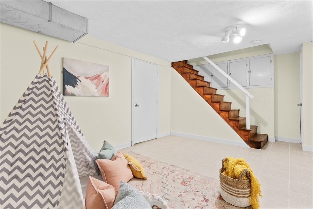 512 Appleton Street Arlington, MA 02476 - Photo 32 of 42 a bedroom with furniture and a painting