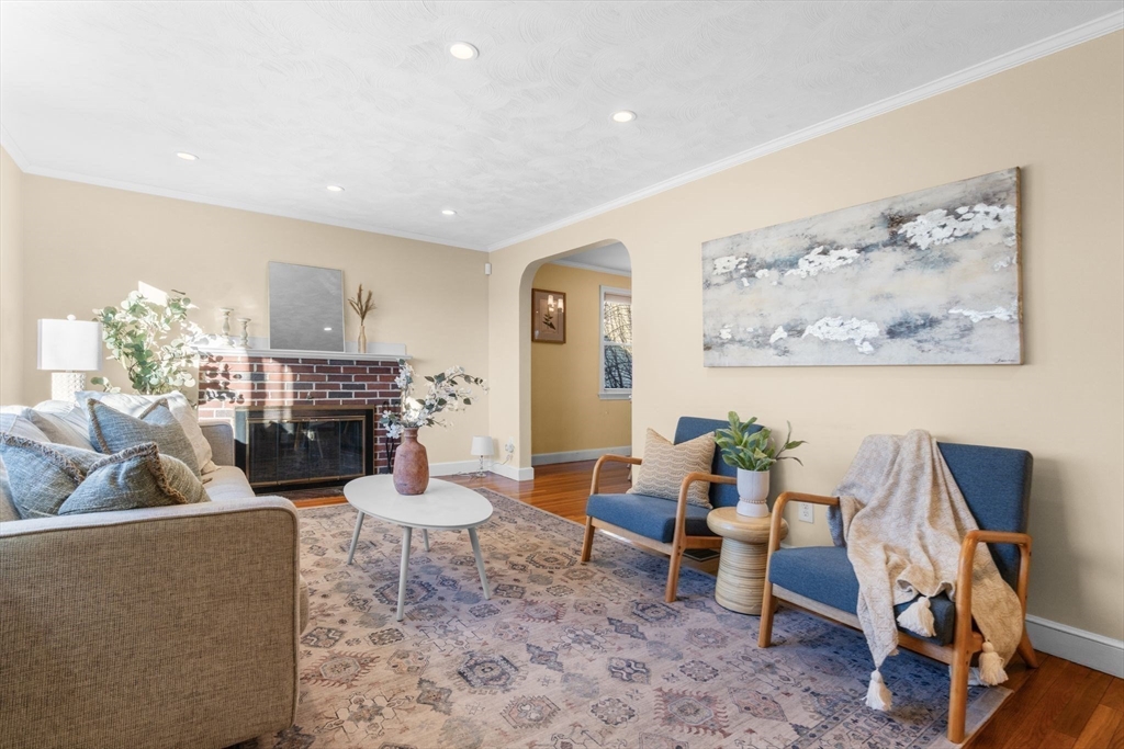 512 Appleton Street Arlington, MA 02476 - Photo 7 of 42 a living room with furniture and a fireplace