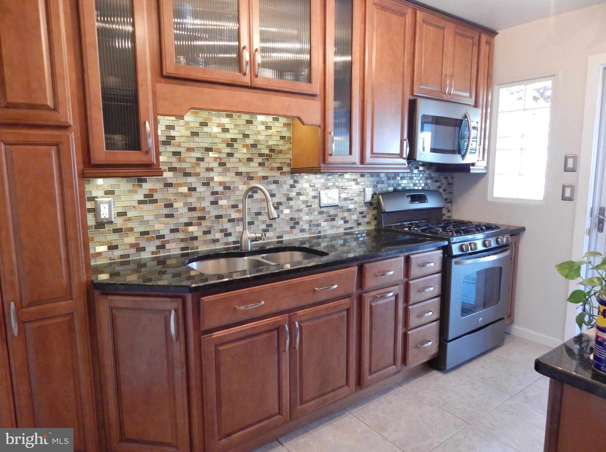 7484 German Hill Road Baltimore, MD 21222 - Photo 9 of 31 Beautiful Kitchen with Granite & Tiled Backsplash