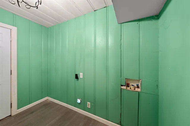 a large kitchen with stainless steel appliances granite countertop a sink counter space and wooden floor