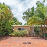 front view of a house with a garden
