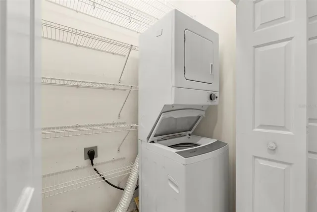 a view of storage and utility room with washer and dryer