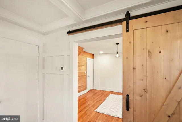 a view of a fire pit with large trees