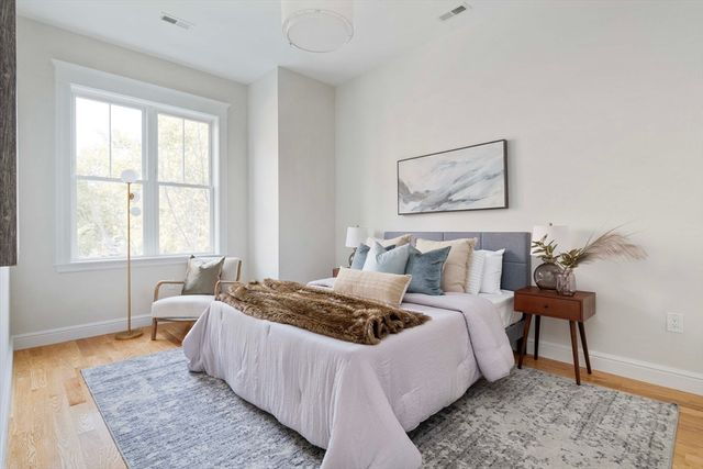 a bed room with a bed and a window