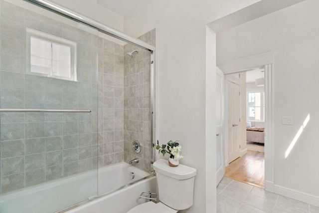 a bathroom with a bathtub toilet and sink