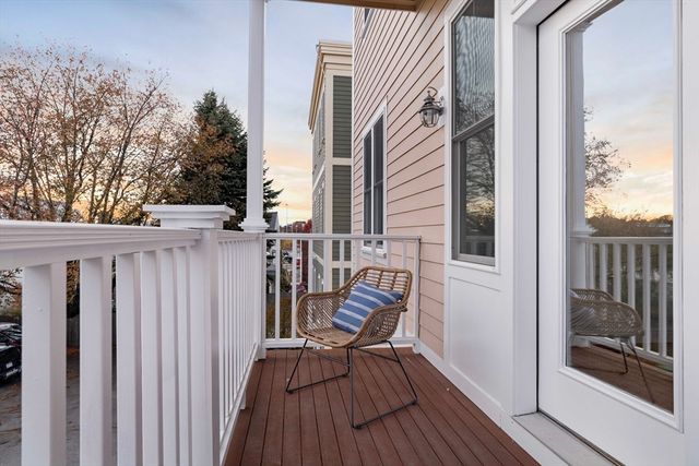 a view of a balcony with furniture