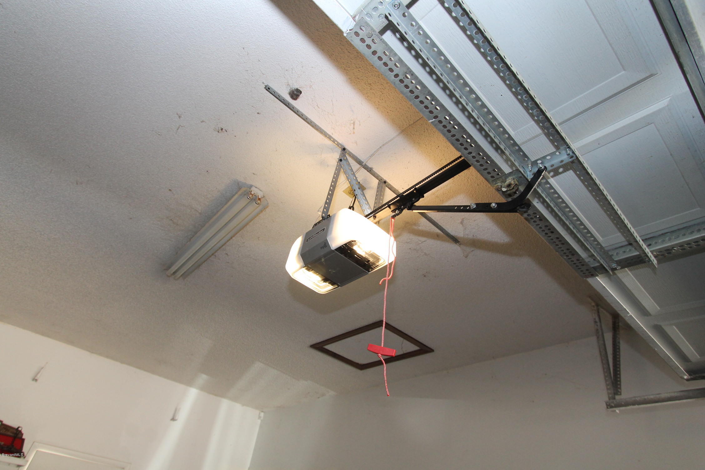 5645 Lord Street Mims, FL 32754 - Photo 33 of 52 new garage door opener