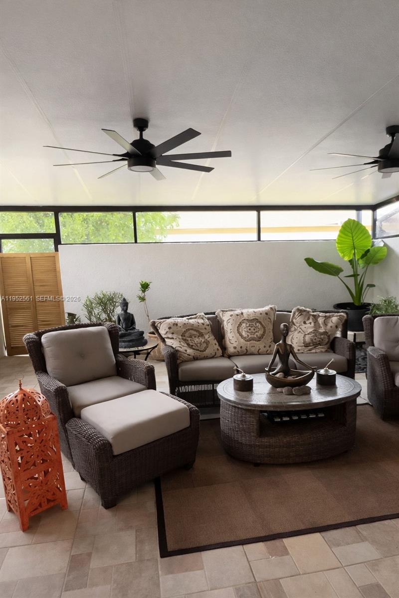 1703 Southwest 131st Pl Circle South Miami, FL 33175 - Photo 17 of 36 a couple of couches sitting in a kitchen