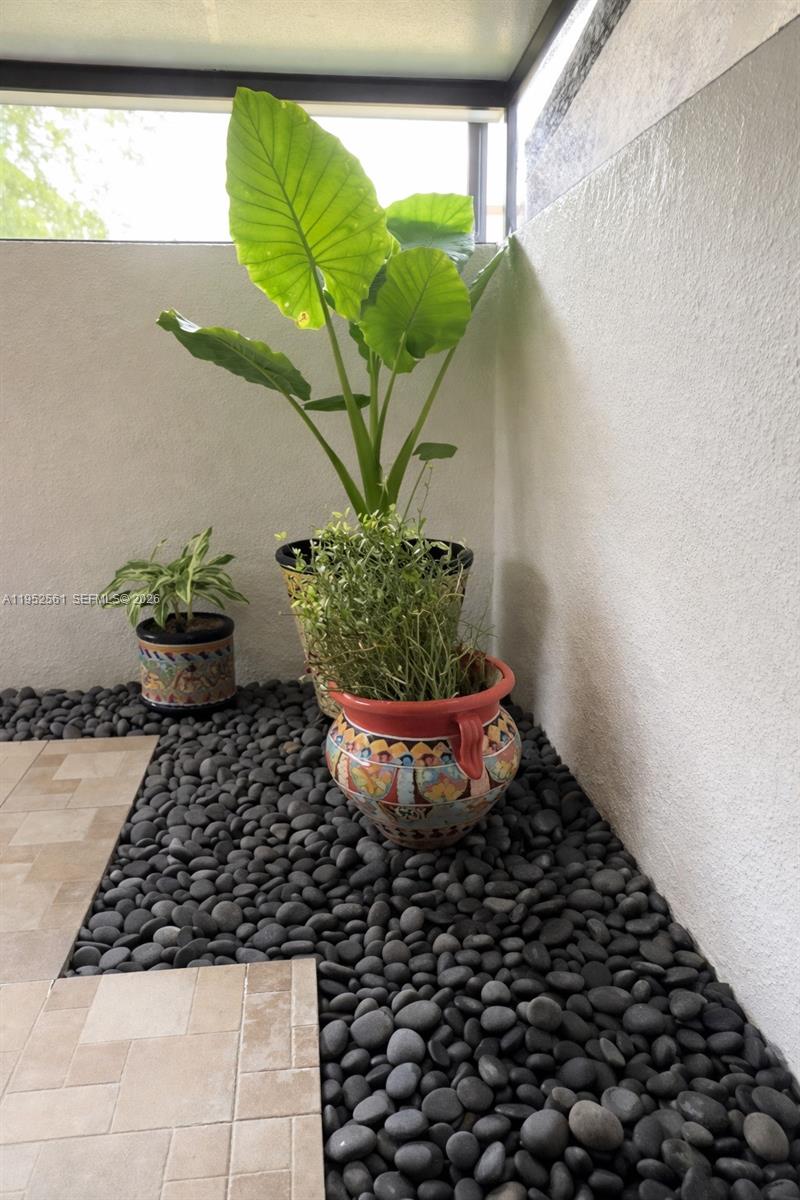 1703 Southwest 131st Pl Circle South Miami, FL 33175 - Photo 18 of 36 a vase of flowers sitting on a table