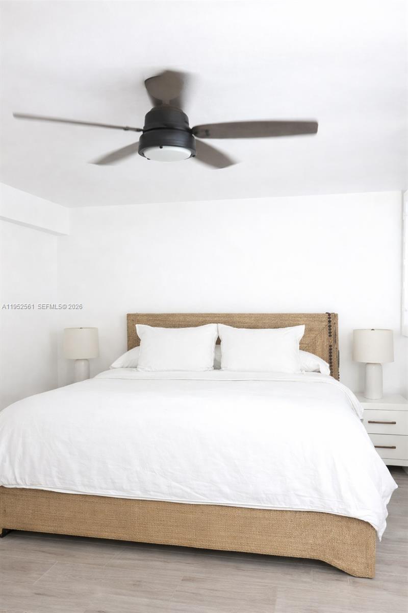 1703 Southwest 131st Pl Circle South Miami, FL 33175 - Photo 25 of 36 a bedroom with a bed and a night stand