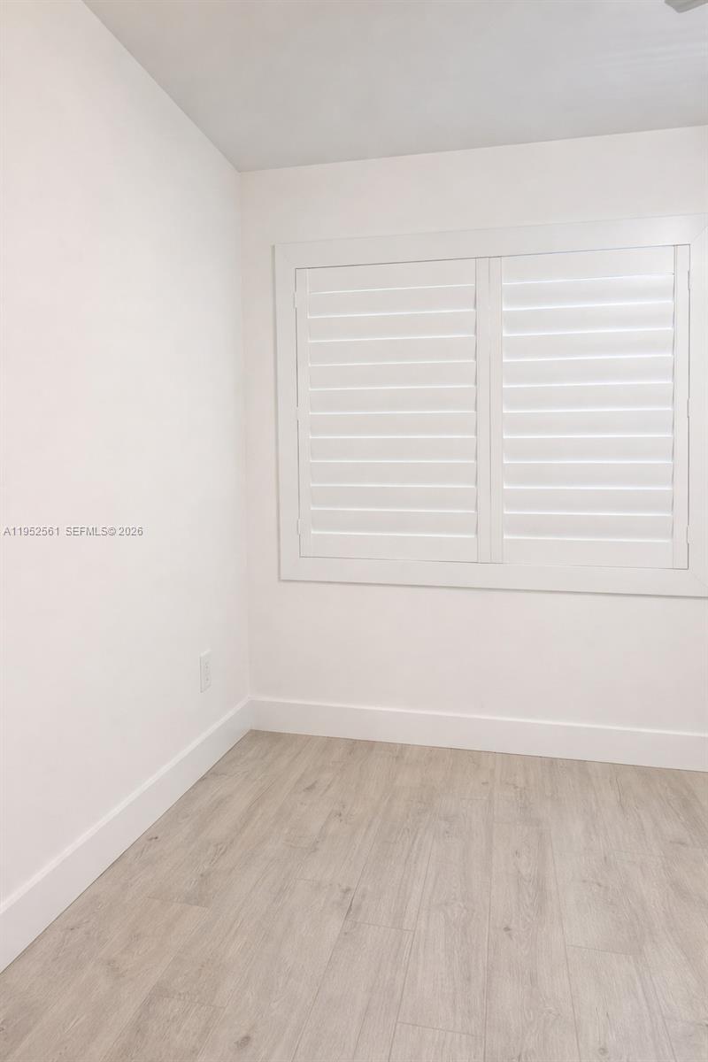 1703 Southwest 131st Pl Circle South Miami, FL 33175 - Photo 31 of 36 an empty room with a window
