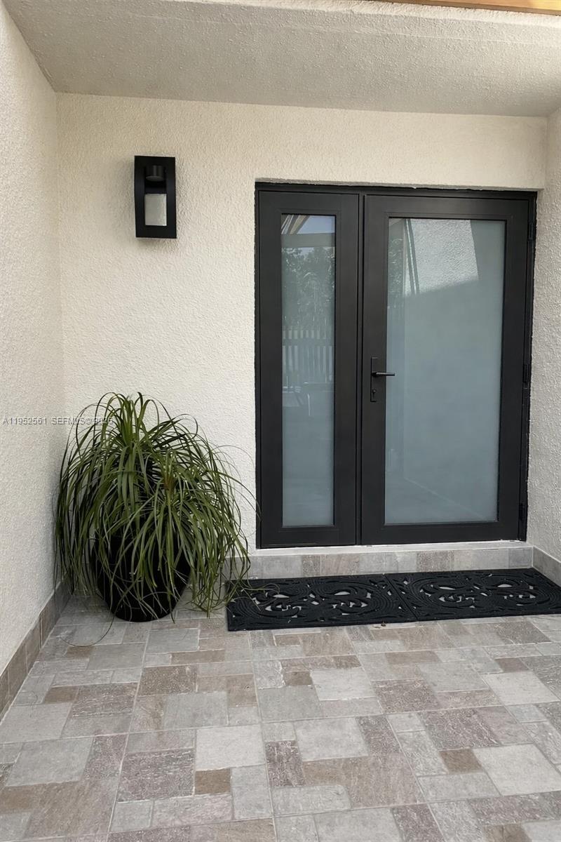 1703 Southwest 131st Pl Circle South Miami, FL 33175 - Photo 4 of 36 a view of a potted plant in a backyard