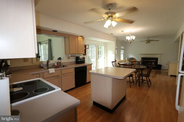 a kitchen with a sink appliances and cabinets