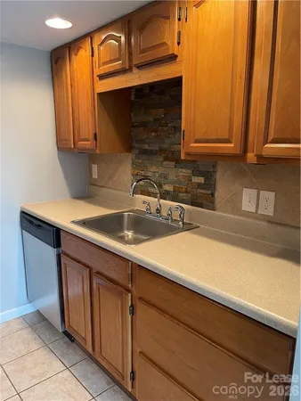 a view of a refrigerator in kitchen and wooden floor
