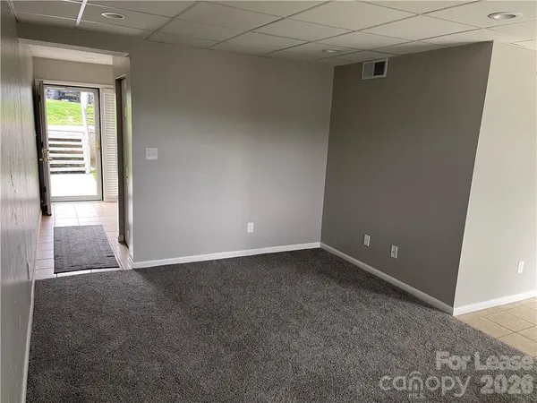 a view of an empty room with a window