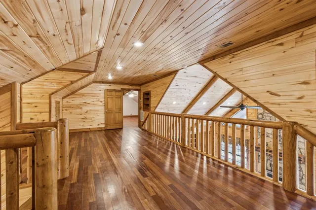 a view of hallway with wooden floor