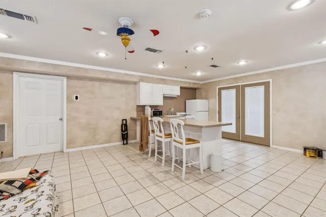 a dining room with furniture and a chandelier